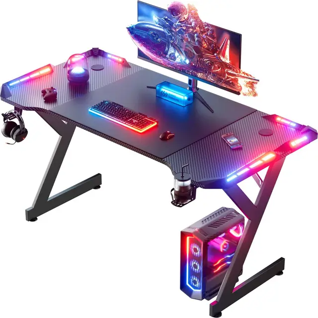 HLONONE LED Bureau Gaming 120 x 60 cm, Bureaux Informatique Ergonomique avec Porte-gobelet et Crochet pour Casque, Bureau Gamer avec Plateau en Fibre de Carbone, Table Gaming Noire
